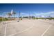 Outdoor basketball court with palm trees and blue sky at 1207 W Sparrow Dr, Queen Creek, AZ 85140