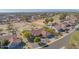 Aerial view of a home with a clay tile roof, surrounded by lush greenery and mature trees at 13913 W Whitewood Dr, Sun City West, AZ 85375