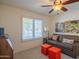 Cozy bedroom features a comfortable sofa and bright accent pieces at 13913 W Whitewood Dr, Sun City West, AZ 85375
