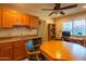 Bonus room features wet bar, cabinets, and a great entertainment space at 13913 W Whitewood Dr, Sun City West, AZ 85375