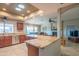 Open kitchen with granite countertops and stainless steel appliances at 13913 W Whitewood Dr, Sun City West, AZ 85375