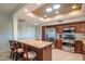 Eat-in kitchen featuring granite counters, dual islands, and stainless appliances at 13913 W Whitewood Dr, Sun City West, AZ 85375