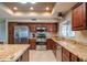 Updated kitchen with granite countertops and stainless steel appliances at 13913 W Whitewood Dr, Sun City West, AZ 85375