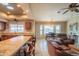 Inviting open concept living room and kitchen with breakfast bar and natural light at 13913 W Whitewood Dr, Sun City West, AZ 85375
