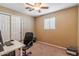 Bedroom with a ceiling fan, desk, closet and a window at 14820 N 35Th St, Phoenix, AZ 85032