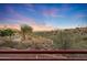 Sweeping landscape views of desert plants, trees and distant mountains at dusk at 15601 E El Lago Blvd, Fountain Hills, AZ 85268