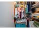 Organized walk-in closet with shelving, hanging rods, and storage bins at 15770 W Remington Dr, Surprise, AZ 85374