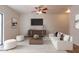 Bright living room featuring a ceiling fan, television, modern furniture and neutral decor at 15818 N 25Th St # 115, Phoenix, AZ 85032