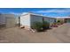 Side view of home, showcasing the storage shed and well-kept grounds at 17200 W Bell Rd # 2162, Surprise, AZ 85374
