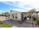 Single-story home with a covered patio and outdoor seating, perfect for enjoying outdoor living at 17200 W Bell Rd # 2162, Surprise, AZ 85374