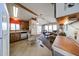 Open-concept living room featuring natural light, with kitchen to the left and sofa with coffee table at 17200 W Bell Rd # 2162, Surprise, AZ 85374