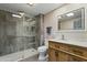 Updated bathroom featuring a tiled walk-in shower, modern vanity, and stylish fixtures at 17410 N Conquistador Dr, Sun City West, AZ 85375