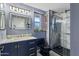 Updated bathroom with modern fixtures, a marble countertop, and a sleek glass shower at 17410 N Conquistador Dr, Sun City West, AZ 85375