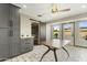 Charming dining area with gray cabinets, a unique table, and natural light from the windows at 17410 N Conquistador Dr, Sun City West, AZ 85375