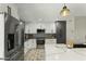 Modern kitchen featuring stainless steel appliances, granite countertops, and ample cabinet space at 17410 N Conquistador Dr, Sun City West, AZ 85375