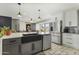 Spacious kitchen with stainless steel appliances, a center island with sink, and ample cabinet space at 17410 N Conquistador Dr, Sun City West, AZ 85375