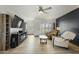 Bright living room with wood-look floors, stylish furnishings, and large windows at 17410 N Conquistador Dr, Sun City West, AZ 85375