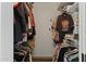 Organized walk-in closet featuring shelving and hanging space for clothing and accessories at 17410 N Conquistador Dr, Sun City West, AZ 85375