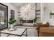 Living room featuring a sleek fireplace and contemporary furnishings at 17429 E Via Del Oro --, Fountain Hills, AZ 85268