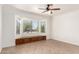 Bedroom featuring a bay window with a built-in bench and tile flooring at 17815 W Calistoga Dr, Surprise, AZ 85387