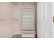 Walk-in closet with white shelving units and a neutral-colored floor at 17815 W Calistoga Dr, Surprise, AZ 85387