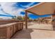 Outdoor patio with an awning and built-in bar area perfect for entertaining at 17815 W Calistoga Dr, Surprise, AZ 85387
