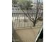 Exterior balcony with metal railing overlooking the street and trees at 18239 N 40Th St # 107, Phoenix, AZ 85032