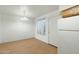 Bright dining area with hardwood floors, a modern chandelier, and a window at 18239 N 40Th St # 107, Phoenix, AZ 85032