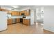 A kitchen featuring stainless steel appliances and wood cabinetry, with a view into the living area at 18239 N 40Th St # 107, Phoenix, AZ 85032