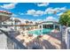 Community pool with lounge chairs provides a refreshing outdoor space for relaxation at 18239 N 40Th St # 107, Phoenix, AZ 85032