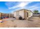 Spacious backyard featuring a fenced area, a storage shed, and a patio at 19412 W Clarendon Ave, Litchfield Park, AZ 85340