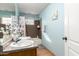 Bright bathroom featuring double sinks, granite counters, and updated faucet fixtures at 19412 W Clarendon Ave, Litchfield Park, AZ 85340