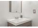 Modern bathroom featuring a sleek vanity, a neutral-toned mirror, and a sink at 19412 W Clarendon Ave, Litchfield Park, AZ 85340