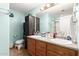 Updated bathroom featuring double sinks, vanity with wood cabinets, and updated fixtures at 19412 W Clarendon Ave, Litchfield Park, AZ 85340