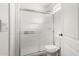 Bathroom showcasing a glass-enclosed shower with white tile and a modern toilet at 19412 W Clarendon Ave, Litchfield Park, AZ 85340