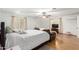 Spacious bedroom boasts a private living area, light walls and curtains, and plenty of natural light at 19412 W Clarendon Ave, Litchfield Park, AZ 85340