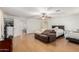 Large primary suite with sitting area, neutral walls, and light flooring at 19412 W Clarendon Ave, Litchfield Park, AZ 85340