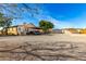 Long ranch style home with gravel driveway and covered parking at 19412 W Clarendon Ave, Litchfield Park, AZ 85340
