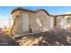 View of the building exterior, showing multiple doorways and minimal landscaping at 19412 W Clarendon Ave, Litchfield Park, AZ 85340