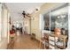 Bright hallway with tile floors, ceiling fan and natural light at 19412 W Clarendon Ave, Litchfield Park, AZ 85340