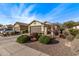 A well maintained home with desert landscaping, rock features and a two car garage at 20558 N 260Th Ln, Buckeye, AZ 85396