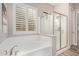 Bathroom with a bathtub and glass-enclosed shower at 2065 N Red Clf, Mesa, AZ 85207