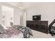 Bedroom with neutral walls, chandelier, and large dresser for storage at 2065 N Red Clf, Mesa, AZ 85207