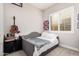Cozy bedroom features a comfortable bed, and ample natural light at 2065 N Red Clf, Mesa, AZ 85207