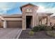 Charming brick home featuring a well-manicured landscape and a paver driveway, creating an inviting curb appeal at 2065 N Red Clf, Mesa, AZ 85207