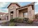 This beautiful home has a brick design, paved driveway, and lush landscaping, which showcases its aesthetic appeal at 2065 N Red Clf, Mesa, AZ 85207