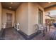 Inviting front porch featuring a charming seating area and elegant decor, perfect for relaxation and welcoming guests at 2065 N Red Clf, Mesa, AZ 85207