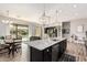 Beautiful kitchen with granite island, pendant lights, and backyard access at 2065 N Red Clf, Mesa, AZ 85207