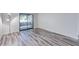 Bright bedroom with wood flooring and access to the outdoor at 2146 W Isabella Ave # 215, Mesa, AZ 85202