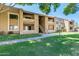 Attractive two-story condo building with well-maintained landscaping and walkways at 2146 W Isabella Ave # 215, Mesa, AZ 85202